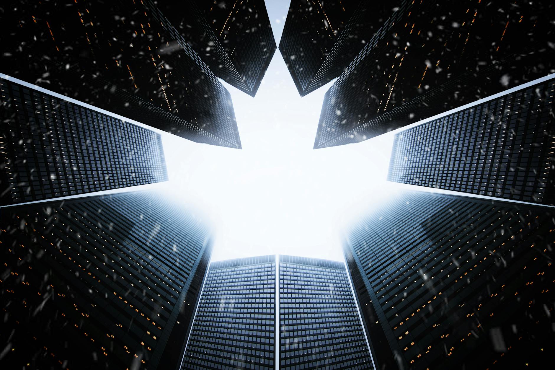 A striking low angle view of skyscrapers forming a maple leaf shape against the sky.